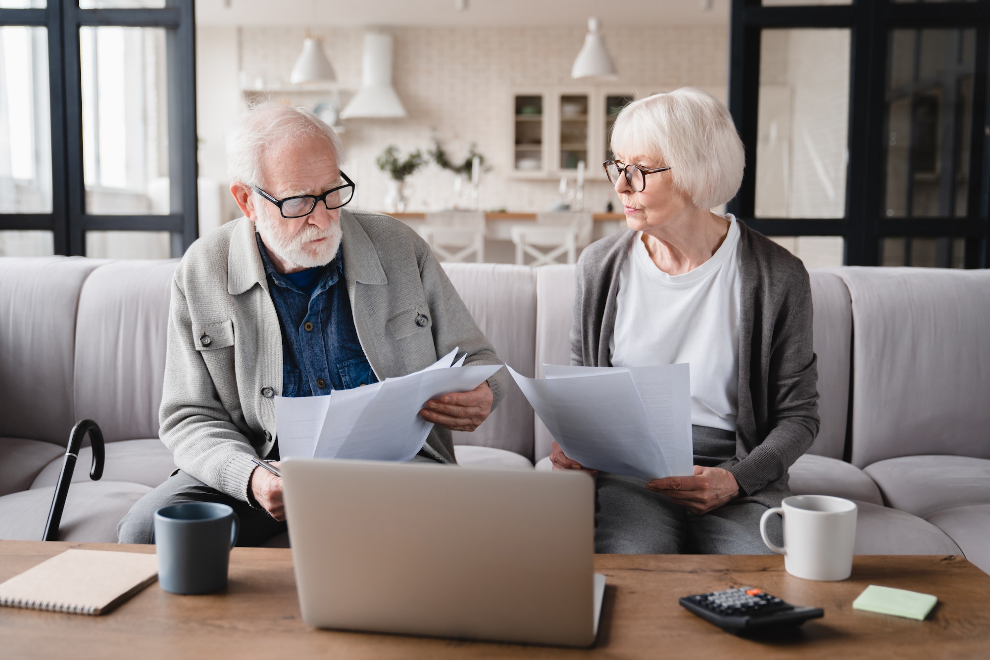 Grandparents counting funds, savings, declarations, investments,paperwork, financial documents